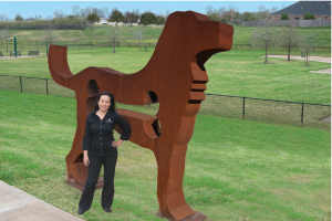 June Tang with the 500 pound “Big Dog” at  Riverstone’s 3.5 acre Bark Park.
