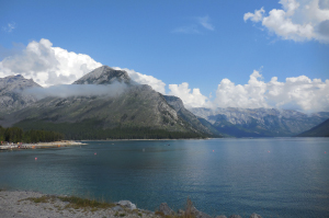 The clear blue water of Lake Minnewanka with Mount Ashley as a backdrop.