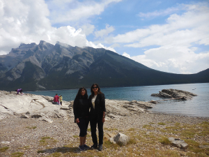 Shanaz Hirji and Zeenat Mitha taking in the beautiful scenery and clear blue water of Lake Minnewanka and Mount Inglismaldie and Mount Girouard as the backdrop in Banff. 