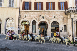 The Turin Café in Perugia, Italy specializes in chocolates and pastries. Tables on the terrace allow visitors to watch the activity in the city center.