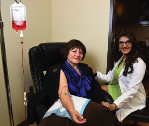 Patient Cynthia A. McConathy receiving an IV vitamin infusion under Dr. Shel’s care. Photo by Nesossi Studios.