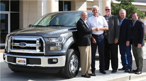 Andy Meyers handing Javier Infante keys to the 2016 Ford F150 Truck with Walt Sass, Jon Strange and Jay Morris.