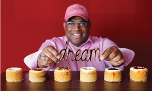 Chef Rey with his signature cheesecakes. Photo by Al Torres Photography.